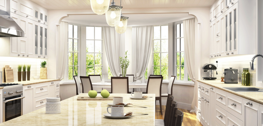 A dining room with white walls and windows.