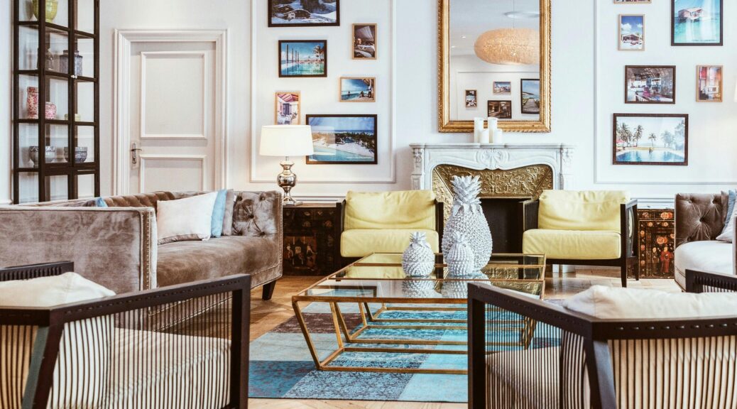 Living room with wooden floors, furniture, and artwork.