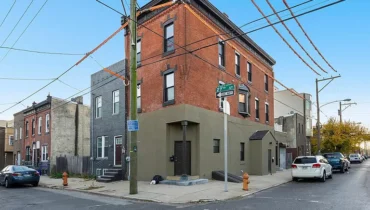 Brick row houses on a city street.